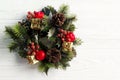 christmas vintage wreath on stylish rustic white wooden background. space for text. holiday greeting card concept. unusual Royalty Free Stock Photo