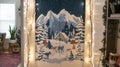 Christmas wall display with snowy forest scene and string lights for festive ambiance Royalty Free Stock Photo