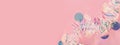 Christmas web banner with tinsel garland on pink background.