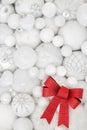 Christmas White Bauble Decorations and Red Bow Background Royalty Free Stock Photo