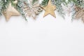 Christmas white Fir tree branches with gold stars decorations Royalty Free Stock Photo