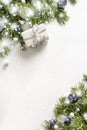 Christmas gift, fir branches on white. Xmas greeting card with copy space Royalty Free Stock Photo
