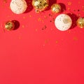 Christmas white and gold decorations, mirror disco balls, star sparkles over red background. Flat lay, top view. Minimal New year Royalty Free Stock Photo