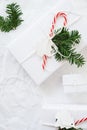 Christmas white handmade gift boxes on white crumpled background top view. Merry Christmas greeting card, frame. Winter xmas holid Royalty Free Stock Photo