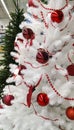 Christmas white tree decorated with red bauble close-up Royalty Free Stock Photo