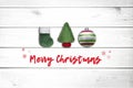 Christmas white wooden background with fir tree, green sock, and christmas ball. View with copy space. Concept holidays Royalty Free Stock Photo