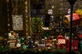 Christmas Gift Boxes and Hampers are Displayed in a Festive Shop Window Display at Night, Creating a Magical Holiday Atmosphere.