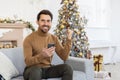 Christmas winner portrait, man celebrating victory and good achievement results, winner looking at camera and smiling