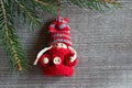 Christmas background - cute figure in a warm sweater hanging fro