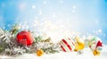 Christmas winter background with gift box, Christmas baubles and fir tree branches on snow Royalty Free Stock Photo