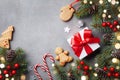 Christmas winter background. Gingerbread cookies, gift or present box and fir tree top view. Bokeh effect Royalty Free Stock Photo