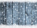 Christmas winter background with snowflakes on blue wood texture with snow Royalty Free Stock Photo