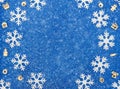 Christmas or winter blue background with white snowflakes, Xmas wooden decorations and snow. New Year greeting card. Christmas, Ne Royalty Free Stock Photo