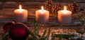 Christmas winter candlelight with candles and tree bulb on wood Royalty Free Stock Photo