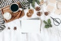 Christmas, winter composition. Blank greeting card mock-up scene. Cup of coffee, gift box, pine cones, fir branches