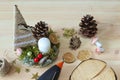 Christmas or winter composition. Top view of homemade candlestick from natural components on light wooden board.