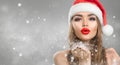 Christmas winter fashion girl on holiday blurred winter background. Beautiful New Year and Xmas holiday makeup