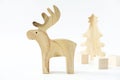 Christmas winter festive ornament. Wooden reindeer, pine tree and gift boxes decoration on white background. Christmas holiday