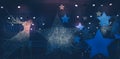 Christmas winter new year holidays Dark night background with Christmas stars lights spotlights with blue pink lilac lights