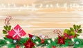 Christmas winter poinsettia background with gift boxes, fir branch, berries on wooden table surface. Royalty Free Stock Photo