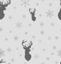 Christmas winter seamless pattern. Head deer silhouette of reindeer and snowflakes with background.