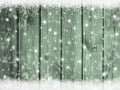 Christmas winter snow background with snowflakes on mint green wooden texture Royalty Free Stock Photo