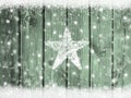 Christmas winter snow background with snowflakes and star on wooden texture Royalty Free Stock Photo