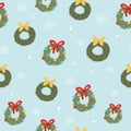 Christmas and winter themed seamless pattern, with Christmas wreaths and white snowflakes on light blue background Royalty Free Stock Photo