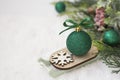 Christmas winter wooden sleigh with green bauble over the snow. Abstract winter greeting card with copy space