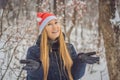 Christmas woman. Beauty model girl in Santa Claus hat. Sales. Closeup Xmas portrait Royalty Free Stock Photo