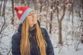 Christmas woman. Beauty model girl in Santa Claus hat. Sales. Closeup Xmas portrait Royalty Free Stock Photo