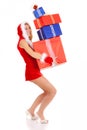 Christmas woman carrying gift pile