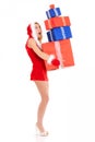 Christmas woman carrying gift pile