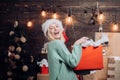 Christmas woman. Celebration. Funny. Portrait of a young smiling woman. New years eve girl. Cute young woman with santa