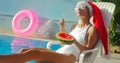 Christmas Woman eating watermelon at the Pool Royalty Free Stock Photo