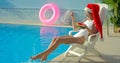 Christmas Woman eating watermelon at the Pool Royalty Free Stock Photo