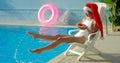 Christmas Woman eating watermelon at the Pool Royalty Free Stock Photo