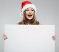 Christmas woman hold big white card. Santa hat. Isolated Royalty Free Stock Photo