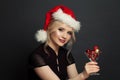 Christmas woman Santa on black background. Christmas holiday and New Year party portrait Royalty Free Stock Photo