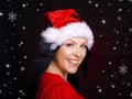 Christmas woman with santa cap and headphones Royalty Free Stock Photo