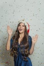 Christmas woman Santa with falling confetti on white background Royalty Free Stock Photo