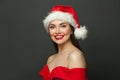 Christmas woman in Santa hat smiling on black background Royalty Free Stock Photo