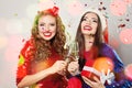 Christmas women laughing. Winter fashion model girls on abstract bokeh glitter sparkle party background Royalty Free Stock Photo