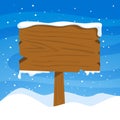 Christmas wood sign on winter background. Christmas wooden street signboad with snow.