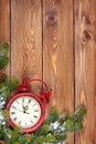 Christmas wooden background with clock, snow fir tree Royalty Free Stock Photo