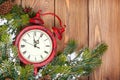 Christmas wooden background with clock, snow fir tree Royalty Free Stock Photo