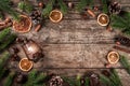 Christmas wooden background with fir branches, lamp, pine cones, gold decoration. Xmas and New Year theme. Flat lay, top view Royalty Free Stock Photo
