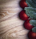 Christmas wooden background. Fir branches with red balls Royalty Free Stock Photo