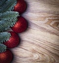 Christmas wooden background. Fir branches with red balls Royalty Free Stock Photo