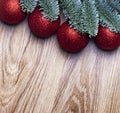 Christmas wooden background. Fir branches with red balls Royalty Free Stock Photo